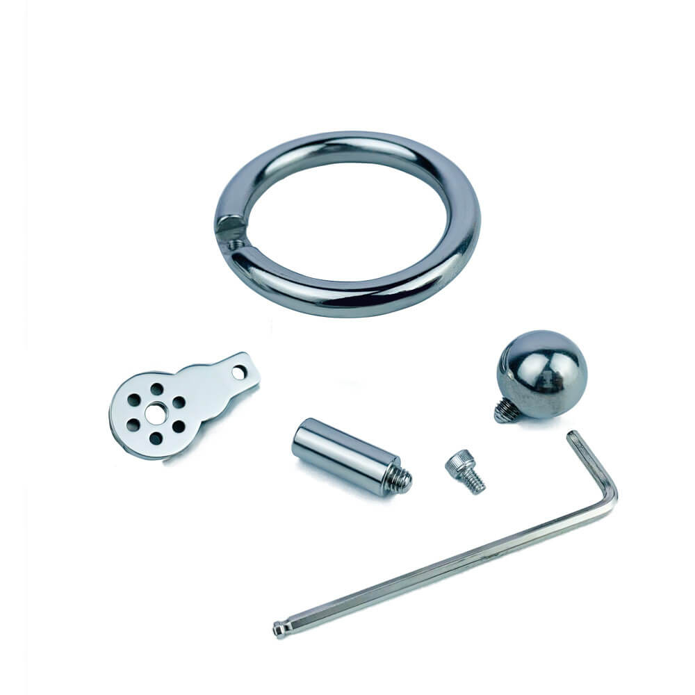 Teileübersicht mit Ring, Kugel, Zwischenstück, Schraube und Werkzeug