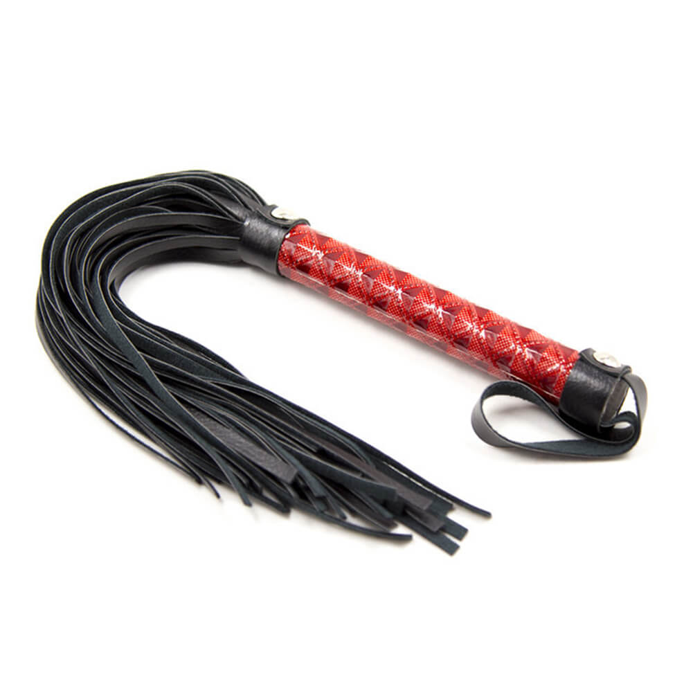 Flogger mit rotem Griff flach liegend