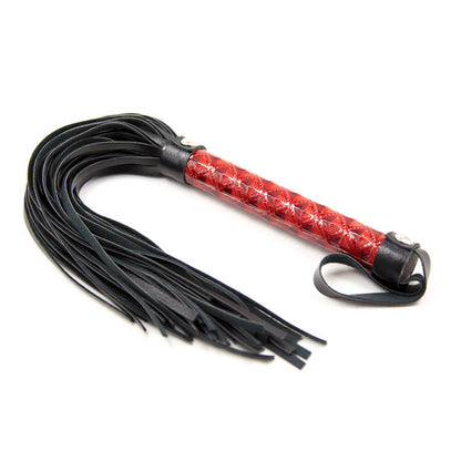 Flogger mit rotem Griff flach liegend