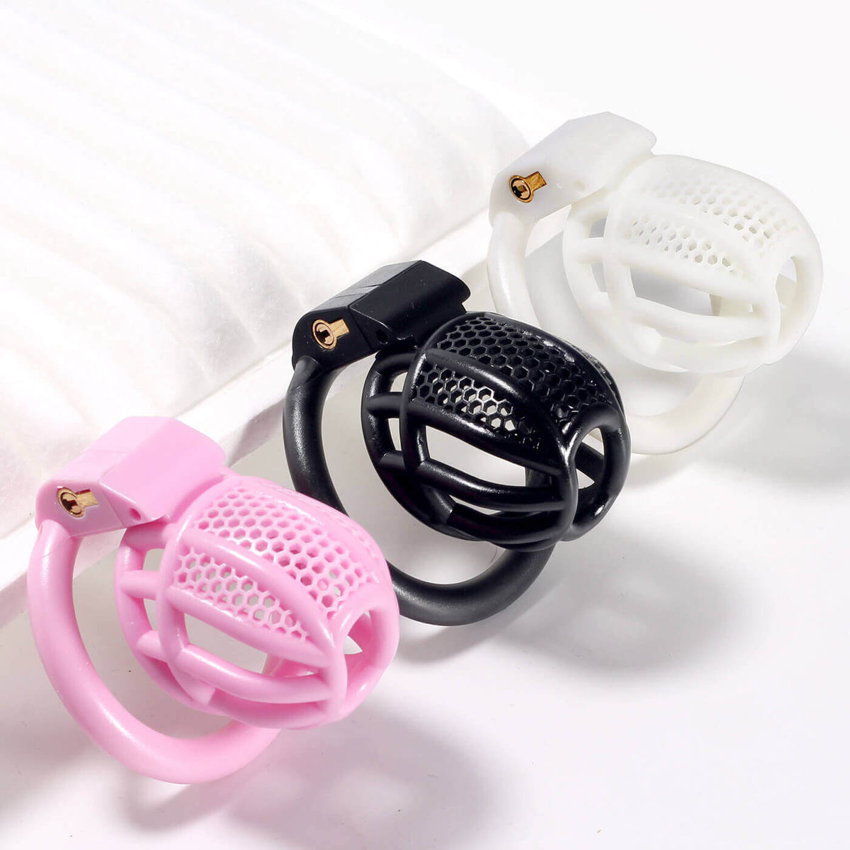 Mini-Honeycomb-Peniskäfige in Rosa, Schwarz und Weiß