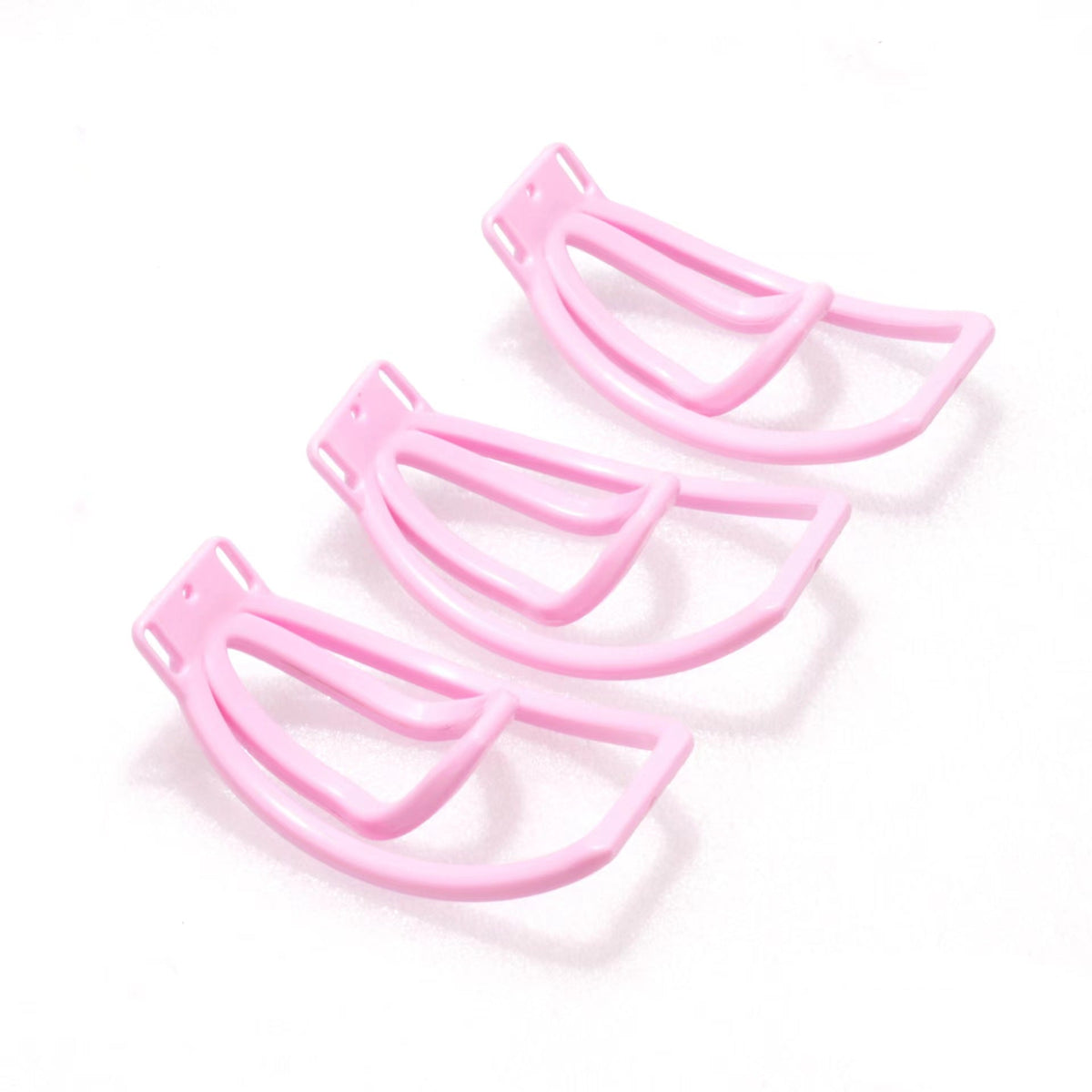 Vergleichsbild mehrerer pinker Clipformen